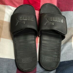 Men’s black gently used Puma slides